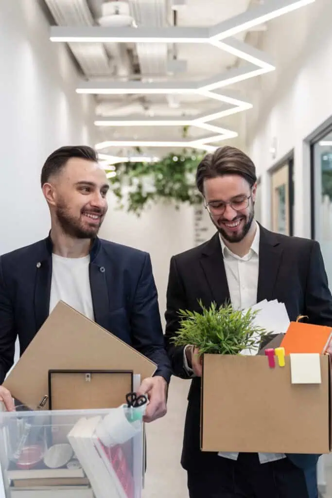 Executive relocation service experts moving office suplies in boxes